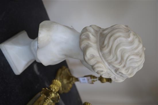 An early 20th century French carved marble bust of a young woman, height 17.5in.